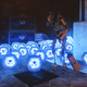 A robot sweeps up dozens of glowing blue engrams in Destiny 2.